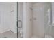 Bathroom features a glass door shower with white wall tiles at 3113 Lakeside Cir, Parrish, FL 34219