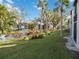 Community pond and fountain, mature trees and lush landscaping at 3255 Beneva Rd # 103, Sarasota, FL 34232