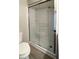 Bathroom with walk-in shower and glass doors at 3334 Overcup Oak Ter, Sarasota, FL 34237