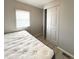 Bedroom with queen-size bed and sliding door closet at 3334 Overcup Oak Ter, Sarasota, FL 34237