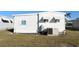White single wide mobile home with AC unit at 3334 Overcup Oak Ter, Sarasota, FL 34237