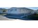 Neat white mobile home with covered carport and mailbox at 3334 Overcup Oak Ter, Sarasota, FL 34237