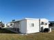 White single wide mobile home with covered patio at 3334 Overcup Oak Ter, Sarasota, FL 34237