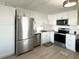 Modern kitchen with stainless steel appliances and white cabinets at 3334 Overcup Oak Ter, Sarasota, FL 34237