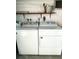 Laundry room with Whirlpool washer and dryer at 3334 Overcup Oak Ter, Sarasota, FL 34237
