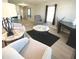 Open living area with comfortable seating and large window at 3334 Overcup Oak Ter, Sarasota, FL 34237