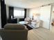 Spacious living room featuring modern furniture and a stylish coffee table at 3334 Overcup Oak Ter, Sarasota, FL 34237