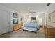 Bright bedroom boasts a queen-sized bed and ample natural light at 3350 Old Oak Dr, Sarasota, FL 34239