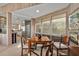 Dining room featuring neutral tones, a sleek table, and abundant natural light at 3350 Old Oak Dr, Sarasota, FL 34239