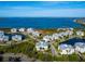 Aerial view of community near the water, lush landscaping at 3450 77Th W St # 102, Bradenton, FL 34209