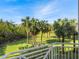 Balcony view of lush green landscape and palm trees at 3450 77Th W St # 102, Bradenton, FL 34209