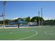 Outdoor basketball court with green surface and surrounding fence at 3450 77Th W St # 102, Bradenton, FL 34209