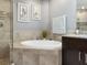 Bathroom with large soaking tub and granite vanity at 3450 77Th W St # 102, Bradenton, FL 34209