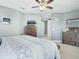 Main bedroom with dresser and TV, access to hallway at 3450 77Th W St # 102, Bradenton, FL 34209