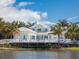 Community clubhouse with deck overlooking a pond at 3450 77Th W St # 102, Bradenton, FL 34209