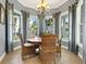 Bright dining area with wicker chairs and a large window at 3450 77Th W St # 102, Bradenton, FL 34209