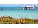 Fishing pier extending over calm, clear water at 3450 77Th W St # 102, Bradenton, FL 34209