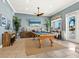 Game room with pool table, TV, and plenty of natural light at 3450 77Th W St # 102, Bradenton, FL 34209