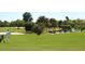 Golfer walking on a lush green golf course at 3450 77Th W St # 102, Bradenton, FL 34209