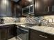 Modern kitchen with stainless steel appliances and granite countertops at 3450 77Th W St # 102, Bradenton, FL 34209