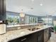 Granite countertop kitchen island with double sink at 3450 77Th W St # 102, Bradenton, FL 34209
