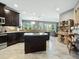 Modern kitchen with island and stainless steel appliances at 3450 77Th W St # 102, Bradenton, FL 34209