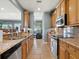 Modern kitchen with granite countertops and wood cabinets at 3450 77Th W St # 102, Bradenton, FL 34209