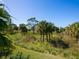 Community landscape with lush vegetation at 3450 77Th W St # 102, Bradenton, FL 34209