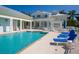 Community pool with plenty of lounge chairs at 3450 77Th W St # 102, Bradenton, FL 34209