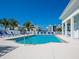 Refreshing community pool with blue lounge chairs at 3450 77Th W St # 102, Bradenton, FL 34209