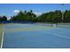 Well-maintained tennis courts with blue surface, ready for play at 3450 77Th W St # 102, Bradenton, FL 34209