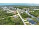High angle view of the neighborhood, canal, and nearby homes at 3479 Knox Ter, Port Charlotte, FL 33948