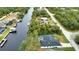 Aerial view of waterfront home with pool and private dock; located on a quiet street at 3479 Knox Ter, Port Charlotte, FL 33948