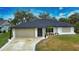 Attractive single-story house with a landscaped yard and driveway at 3479 Knox Ter, Port Charlotte, FL 33948