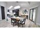 Bright dining room with wooden table and modern chandelier at 3479 Knox Ter, Port Charlotte, FL 33948