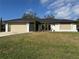 Updated single-story home with a modern facade and a well-maintained lawn at 3479 Knox Ter, Port Charlotte, FL 33948