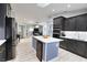 Open concept kitchen with island, stainless steel appliances, and hardwood floors at 3479 Knox Ter, Port Charlotte, FL 33948