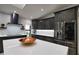 Updated kitchen featuring stainless steel appliances and an island with seating at 3479 Knox Ter, Port Charlotte, FL 33948