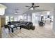 Spacious living room featuring a sectional sofa and a modern fireplace at 3479 Knox Ter, Port Charlotte, FL 33948
