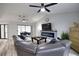 Open living area with sectional sofa, fireplace, and access to backyard at 3479 Knox Ter, Port Charlotte, FL 33948