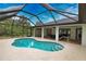 Enjoy this refreshing pool with a screened enclosure at 3479 Knox Ter, Port Charlotte, FL 33948