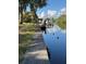 Waterfront view featuring a boat dock with boat, seawall and pristine water at 3479 Knox Ter, Port Charlotte, FL 33948
