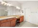 Double vanity bathroom with large mirror and walk-in shower at 3614 Summerwind Cir, Bradenton, FL 34209