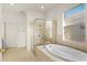Bathroom features a large soaking tub and walk-in shower at 3614 Summerwind Cir, Bradenton, FL 34209