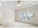 Spacious bedroom with ceiling fan and large window at 3614 Summerwind Cir, Bradenton, FL 34209