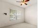 Well-lit bedroom featuring a ceiling fan and window blinds at 3614 Summerwind Cir, Bradenton, FL 34209