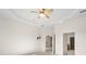 Bedroom with ceiling fan and access to bathroom and other rooms at 3614 Summerwind Cir, Bradenton, FL 34209