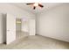 Bright bedroom with doors to another room and ceiling fan at 3614 Summerwind Cir, Bradenton, FL 34209