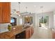 Kitchen island with granite countertops and stainless steel dishwasher at 3614 Summerwind Cir, Bradenton, FL 34209