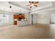 Kitchen with light wood cabinets, granite countertops, and island at 3614 Summerwind Cir, Bradenton, FL 34209
